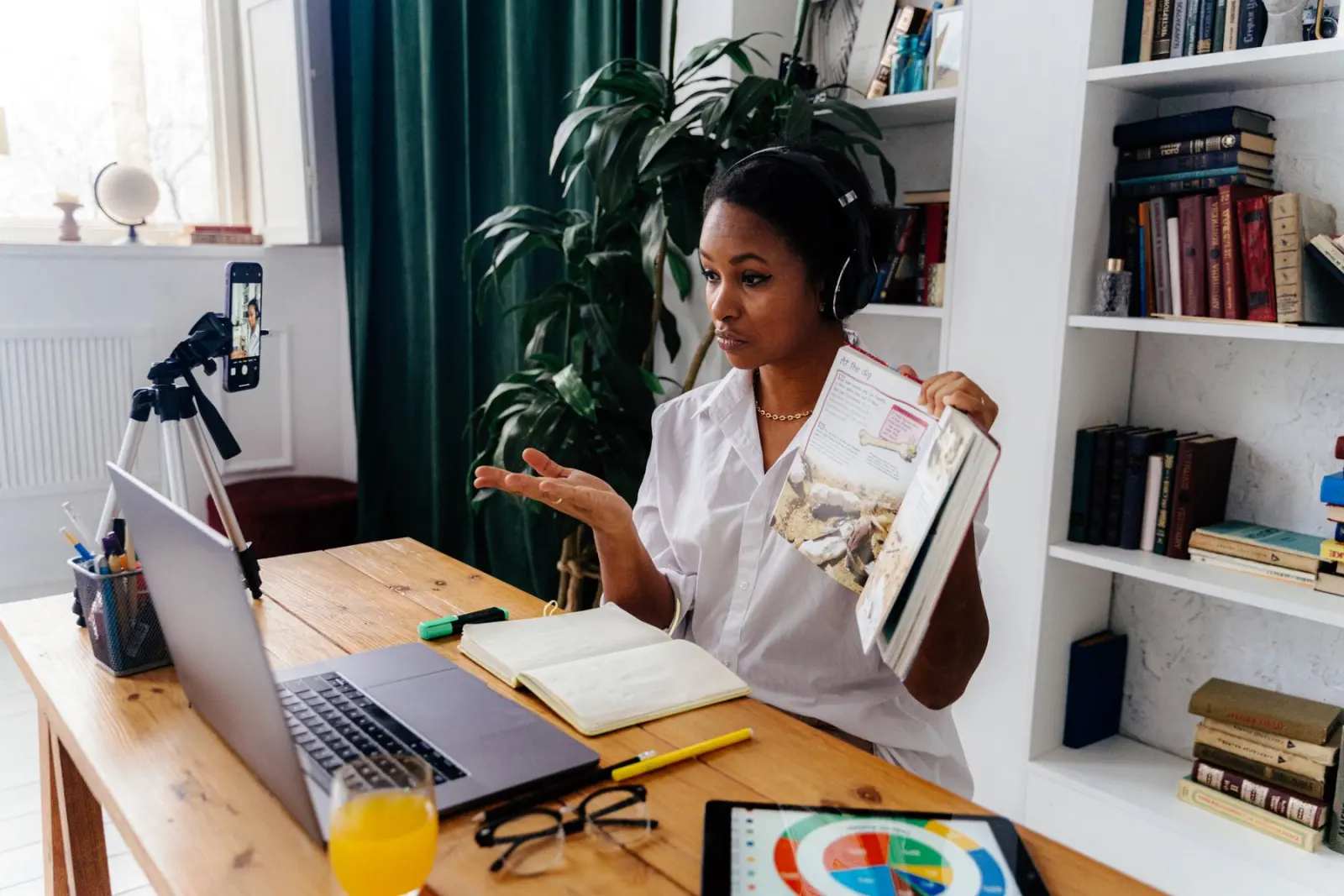 A teacher at her desk preparing an online lesson